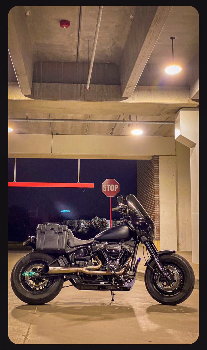 Stealth Pipes exhaust system installed on Harley M8 Softail – rear-side view of muffler and headers (2017–2025)