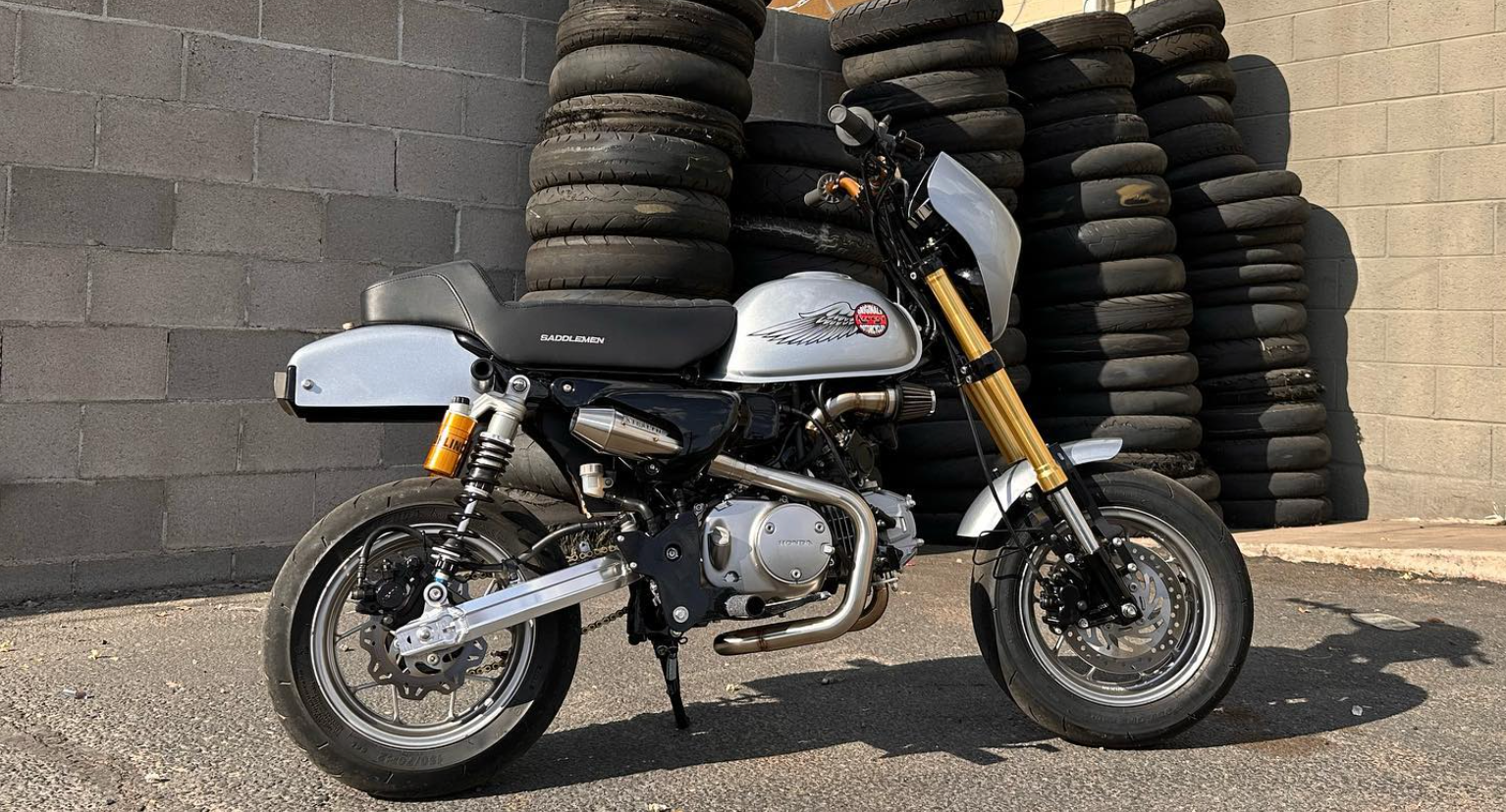 Honda Monkey with Stealth x Kruesi Originals exhaust system – rear angle showing stainless muffler